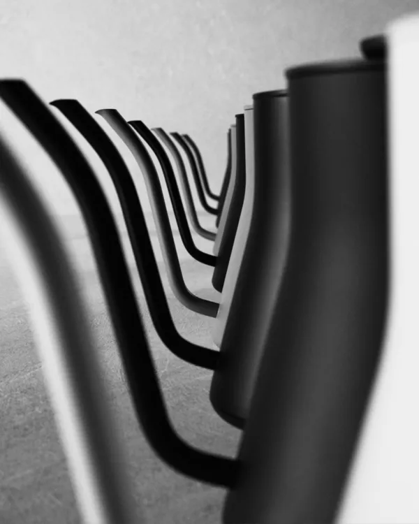 A row of matte black gooseneck spouts