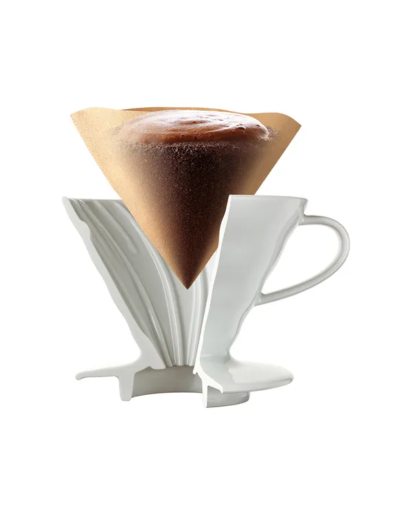 A V60 paper filter holding a bed of coffee